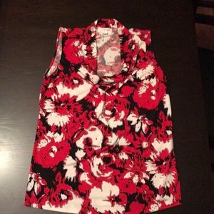 A sleeveless dress blouse